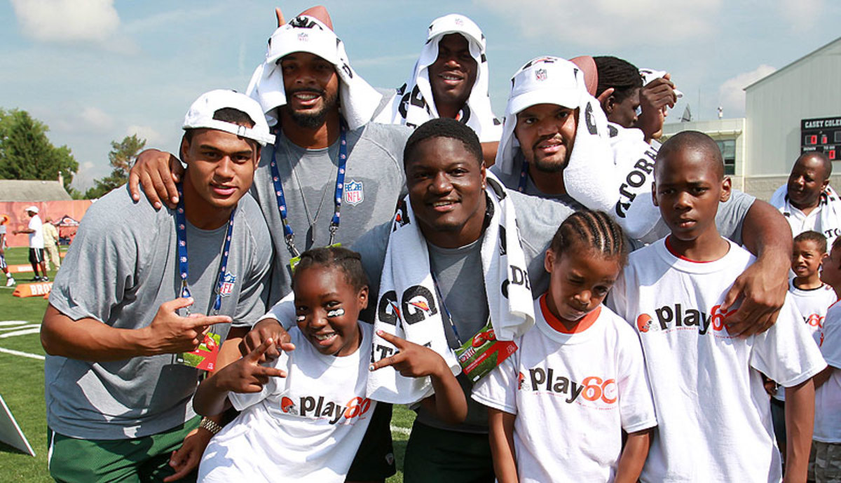Rookies spent part of the symposium with Cleveland area youth at an NFL Play 60 event. (Phil Long/AP)