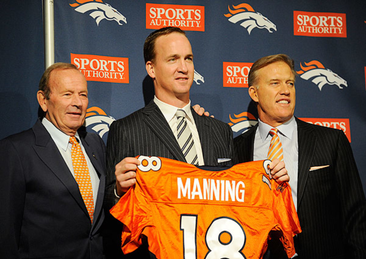 Peyton Manning (center) signed with Broncos prior to the 2012 season.