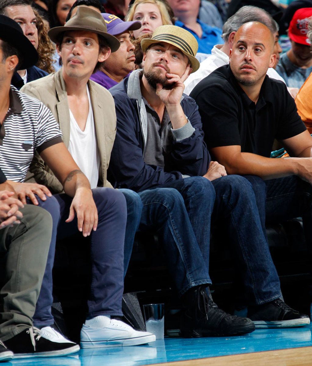 2012-0409-Leonardo-DiCaprio-Lukas-Haas-Hornets-game.jpg