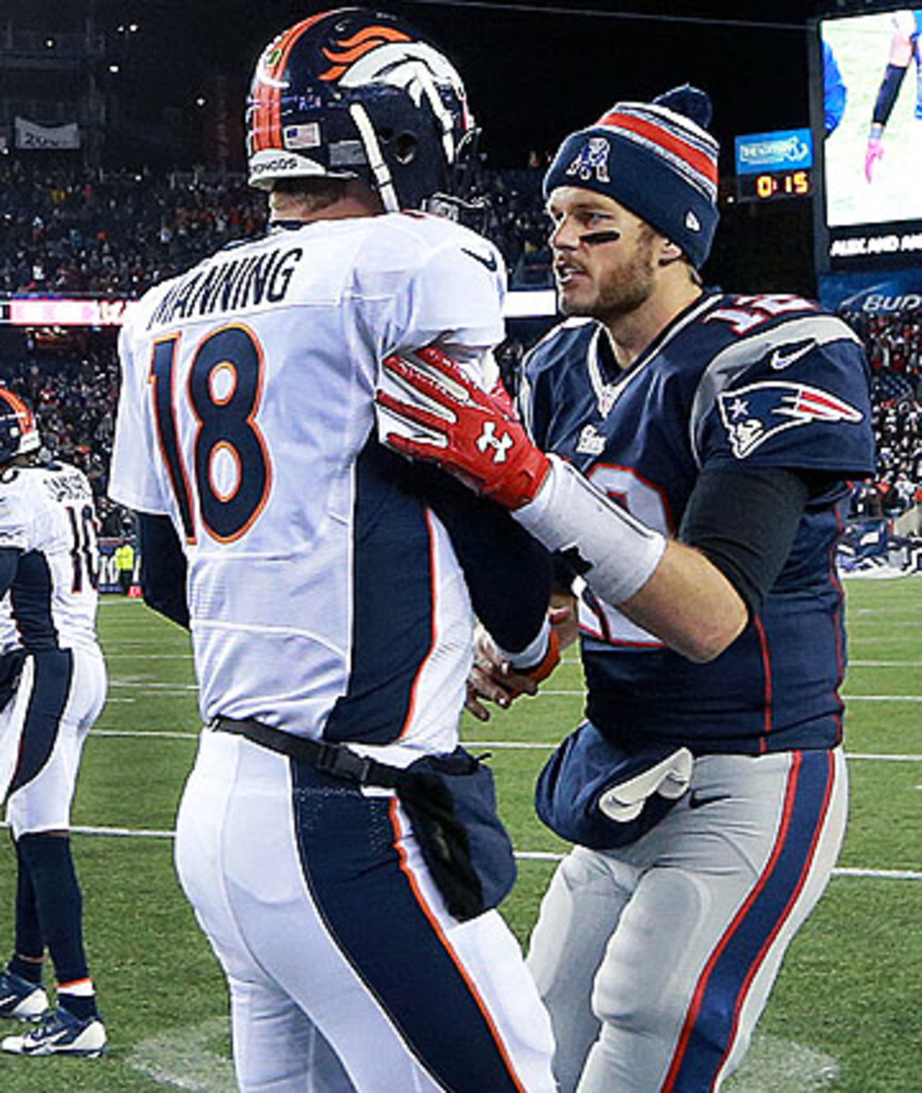 Tom Brady and Peyton Manning will meet again in 2015 since their teams each won their divisions this season. (Jim Davis/Getty Images)