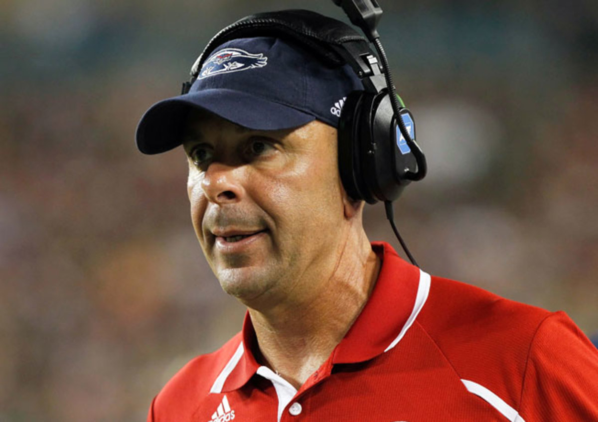 Carl Pelini was fired as FAU's coach last October for failing to 'timely report' conduct of a staff member.