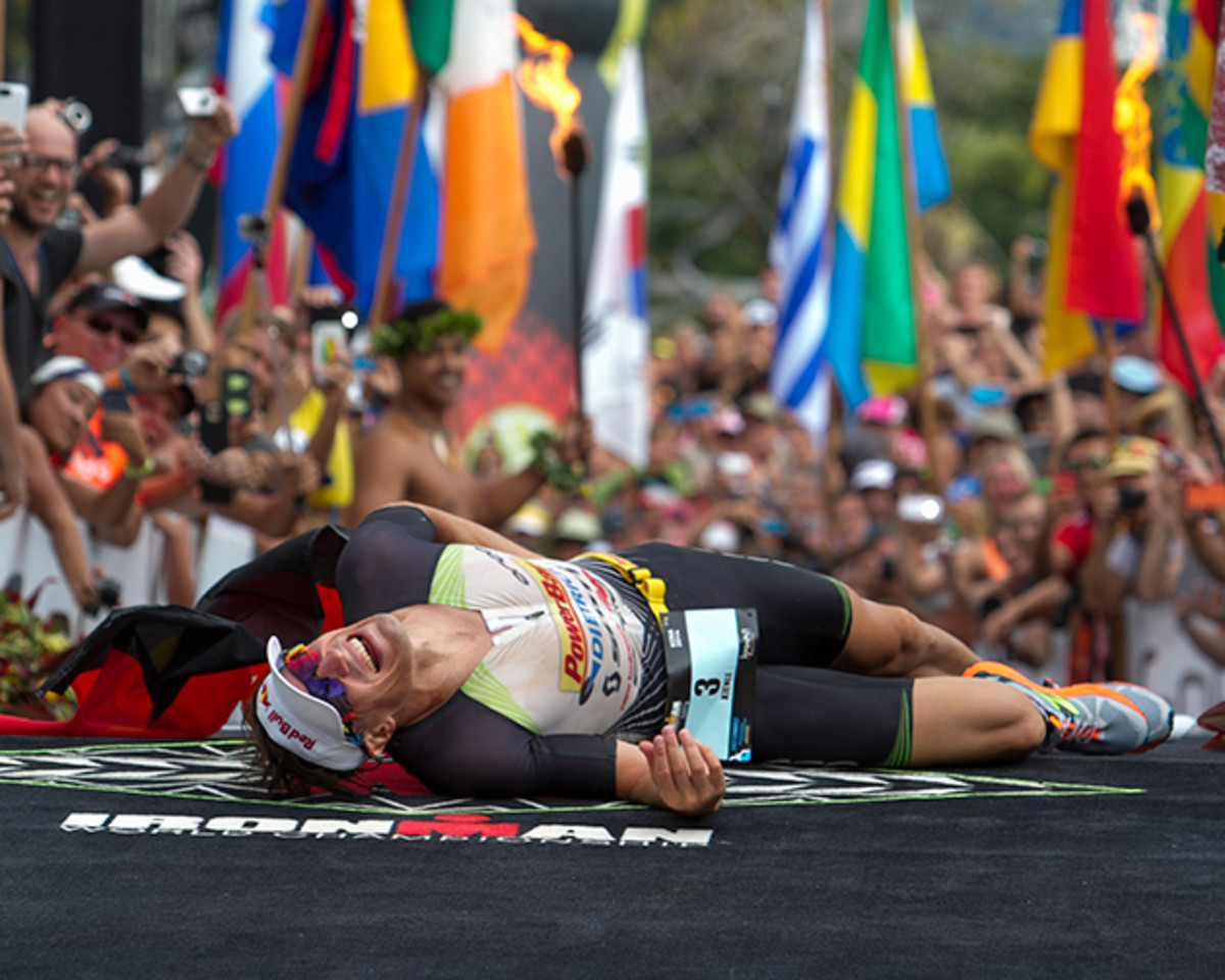 Sebastian Kienle, of Germany, reacts after winning the men's 2014 IRONMAN World Championship.