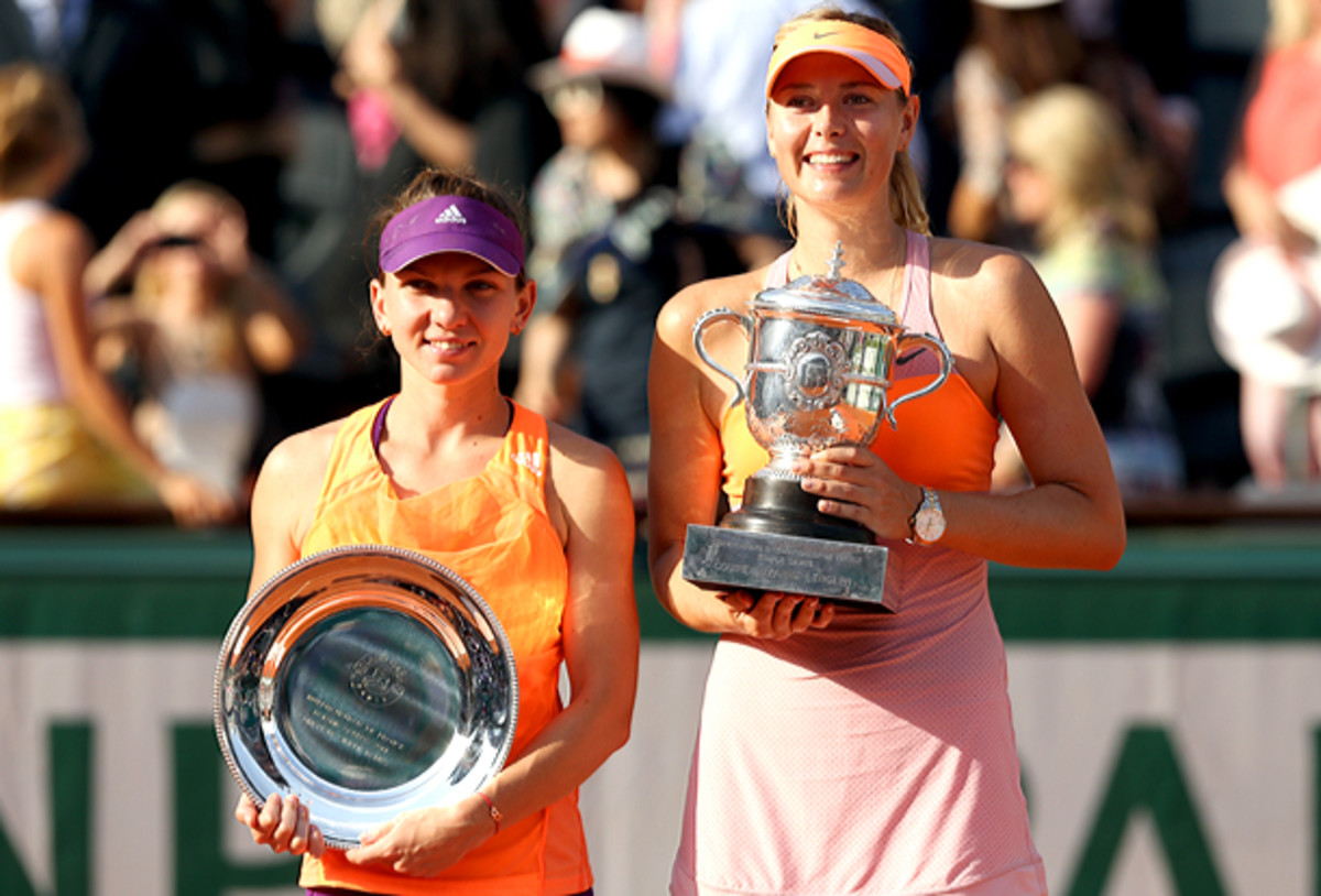 Simona Halep and Maria Sharapova pose during the French Open trophy presentation. (Matthew Stockman/Getty Images0