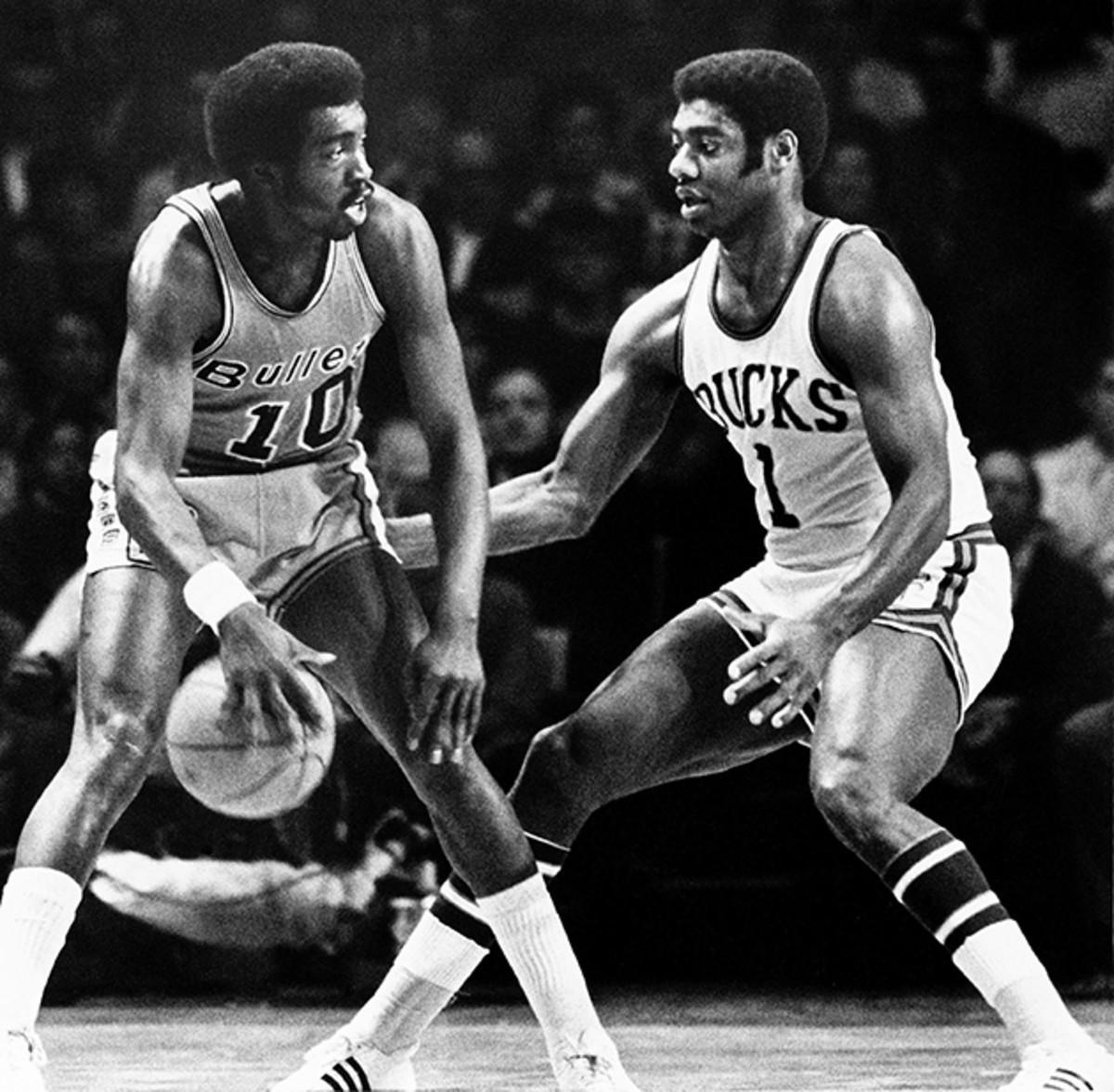 Earl Monroe of the Baltimore Bullets moves the ball against Oscar Robertson during a game against the hometown Milwaukee Bucks at the MECCA Arena in 1970.