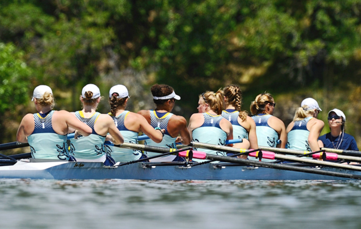 Jill Costello (right, in navy) coxes the top women's boat, all wearing special turquoise unis in honor of Jill, in the 2010 NCAA championships.