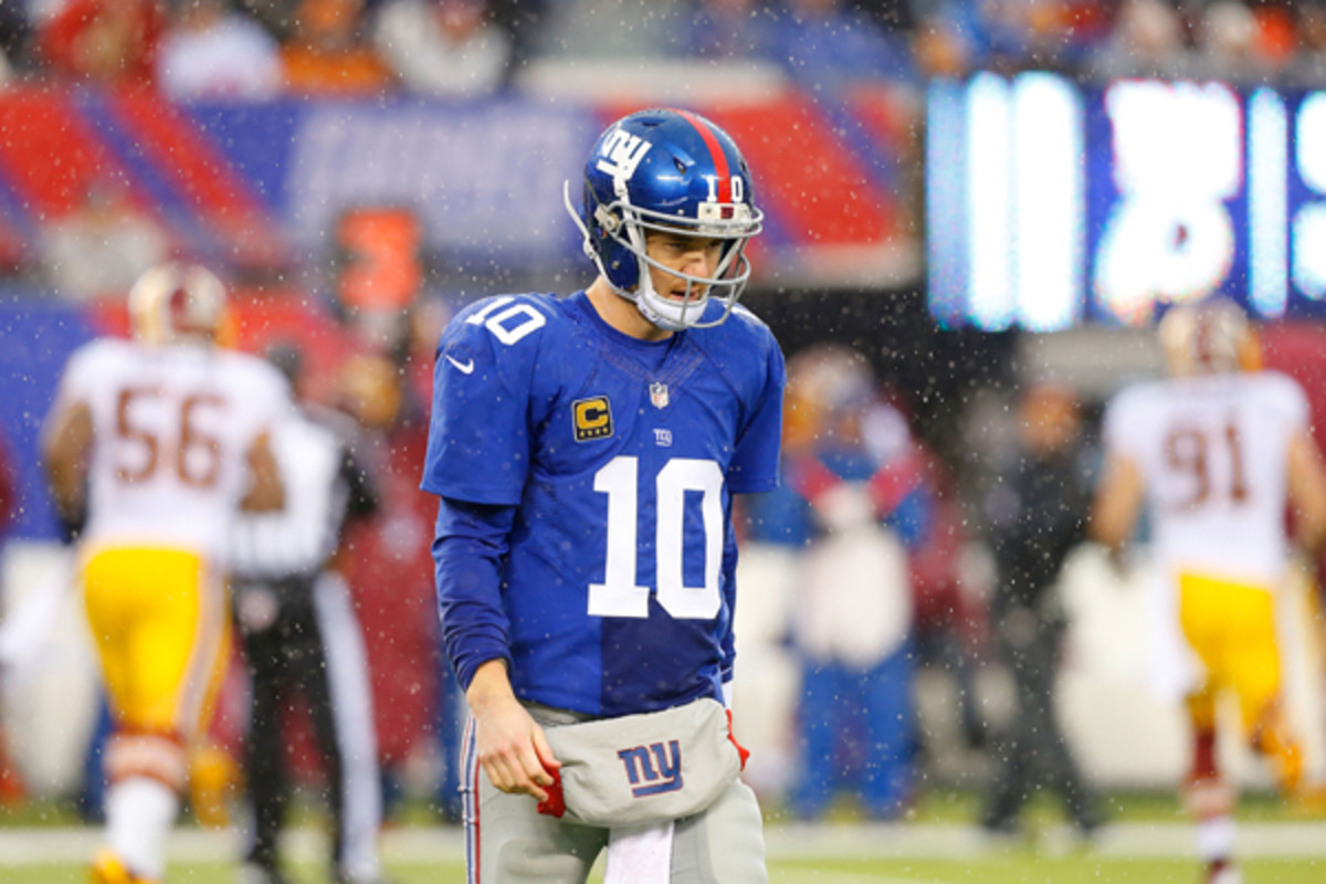 Eli Manning injured his ankle in his team's season finale against Washington. (Jim McIsaac/Getty Images)