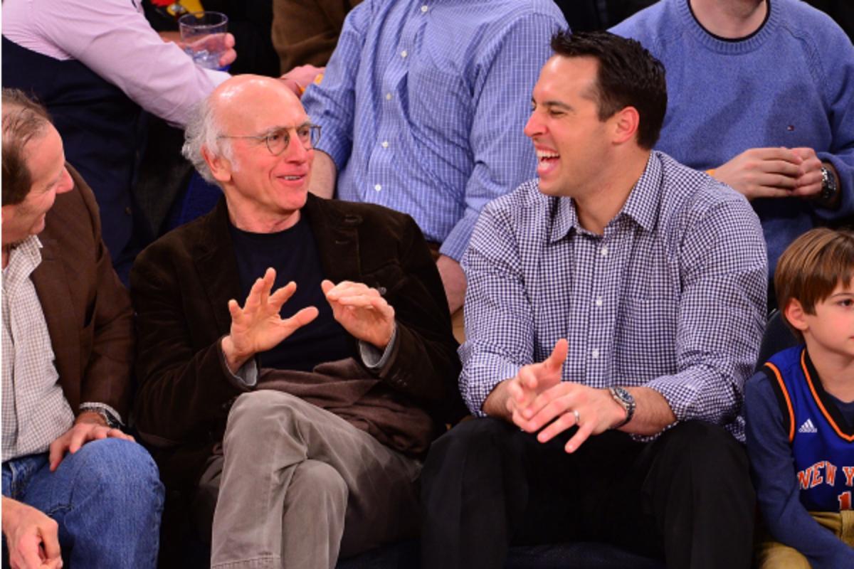 Mark Teixeira (right) took in a Knicks game with comedian Larry David last month. (James Devaney/Getty Images)