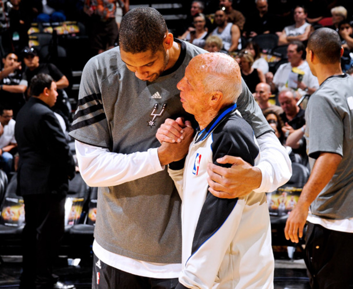 Bavetta shares a tender moment with Tim Duncan. (D. Clarke Evans/NBAE via Getty Images)