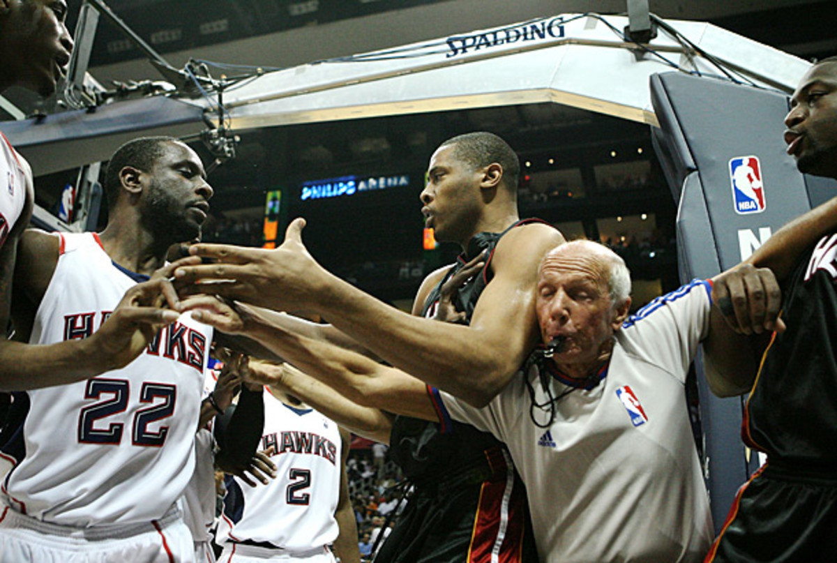 Bavetta gets in the middle of the action during a tense moment in a Heat-Hawks game. (Doug Benc/Getty Images)