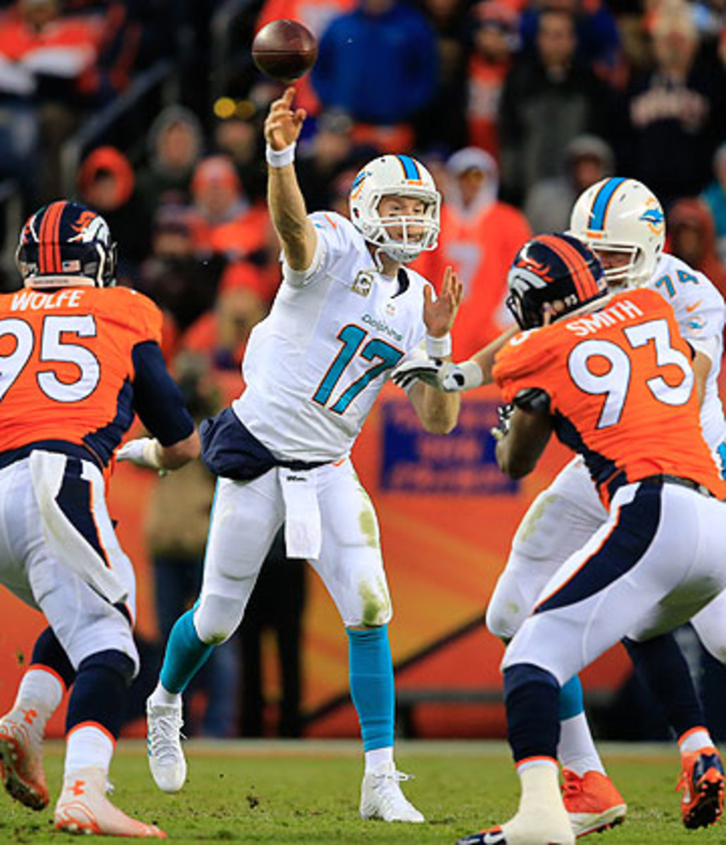 Ryan Tannehill stood tall against the Broncos, but the 6-5 Dolphins still face an uphill climb to make the postseason. (Doug Pensinger/Getty Images)