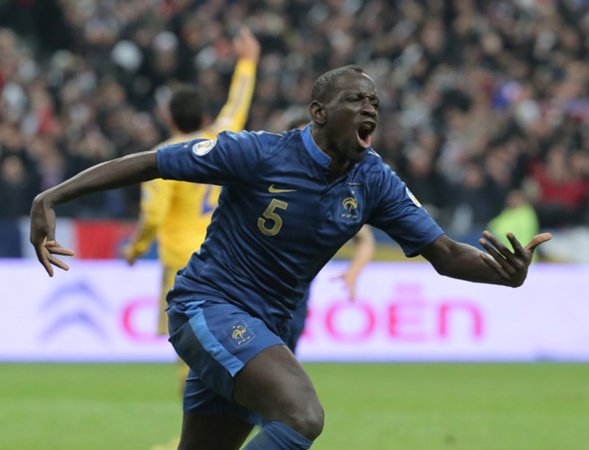 Mamadou Sakho celebrates one of his two goals against Ukraine, which helped France overcome a two-goal deficit in their World Cup qualifying playoff.