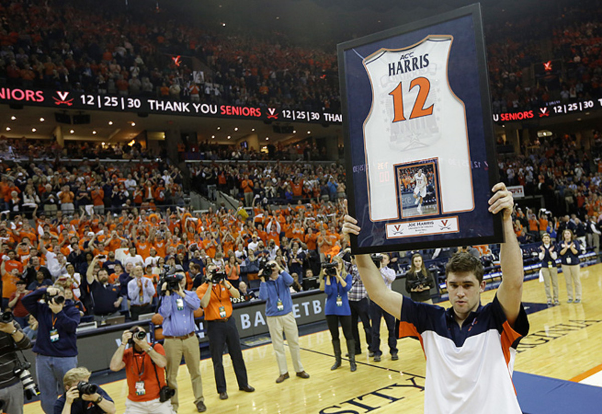 Joe Harris holds up his jersey before the Syracuse game that secured Virginia its first outright ACC title in 33 years.