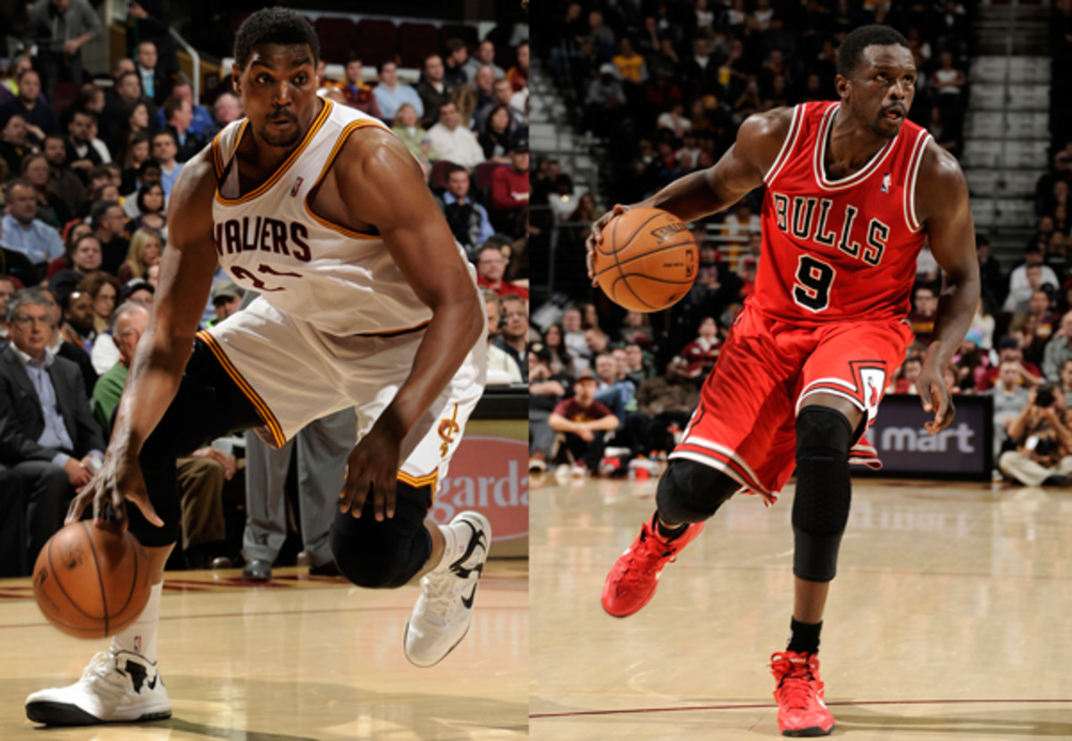 Cavaliers center Andrew Bynum (left) was traded to the Bulls for forward Luol Deng (right). (David Liam Kyle/Getty Images)