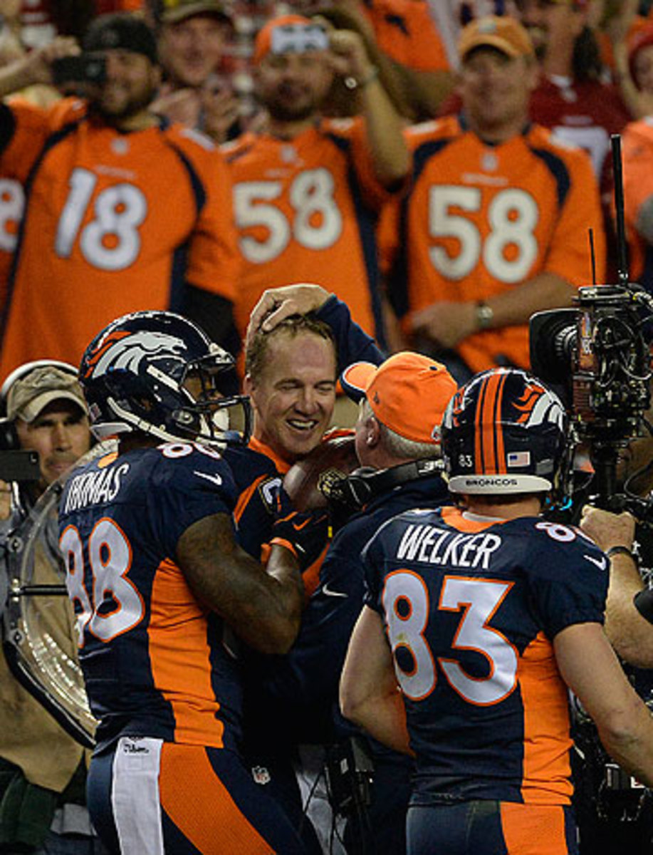 The game paused after Manning's 509th touchdown, as coaches and teammates celebrated the achievement. (Aaron Ontiveroz/Getty Images)