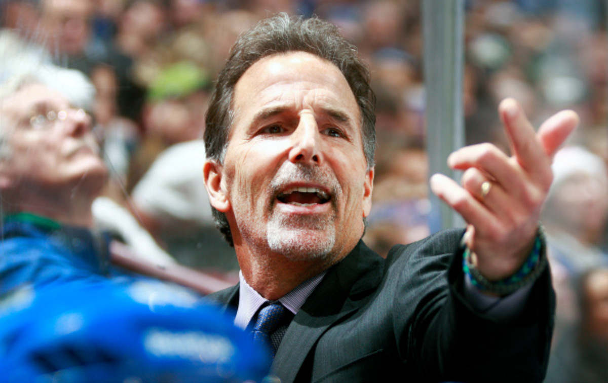 John Tortorella tried to enter the Flames' locker room on Saturday during an altercation. (Jeff Vinnick/NHL)