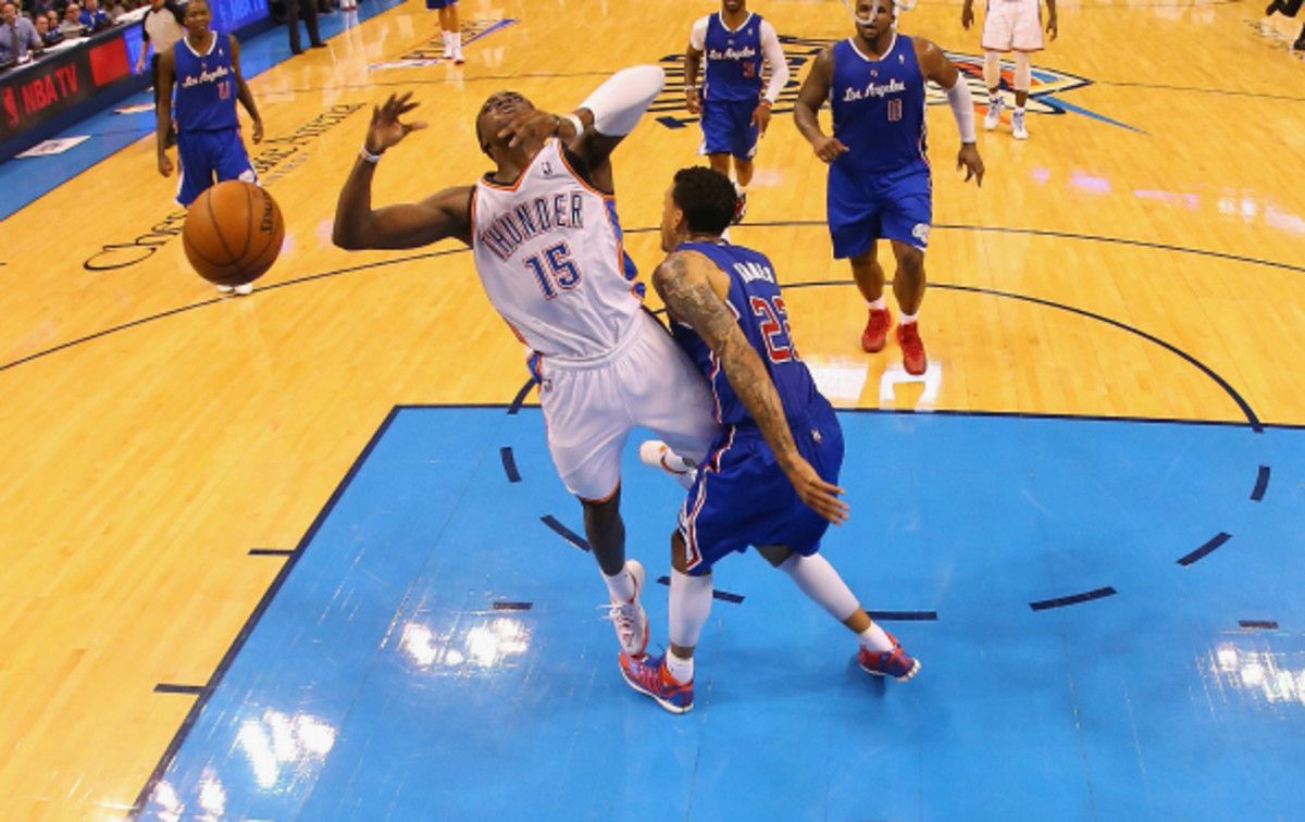 Matt Barnes appeared to foul Reggie Jackson on the play but no whistle was blown. (Ronald Martinez/Getty Images)