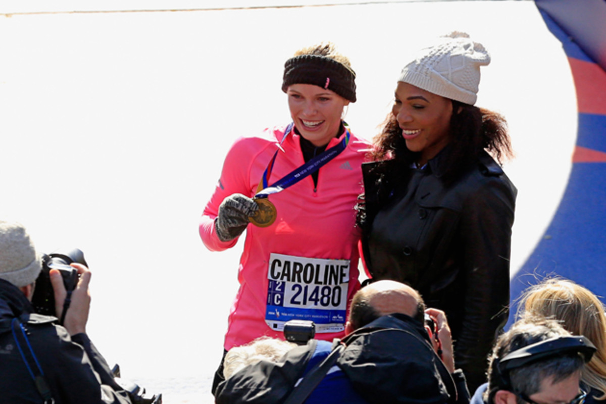 Wozniacki celebrates with Serena after finishing the 2014 New York City Marathon in November.