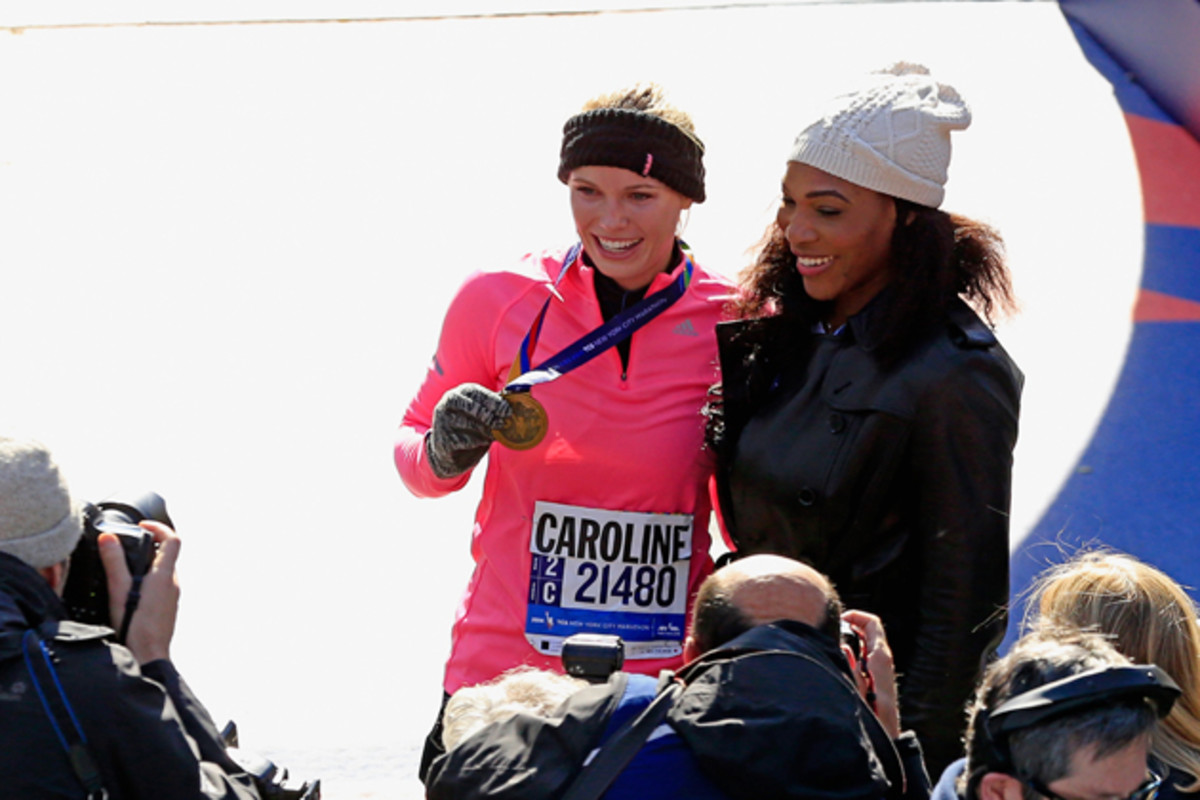 Wozniacki celebrates with Serena after finishing the 2014 New York City Marathon in November. 