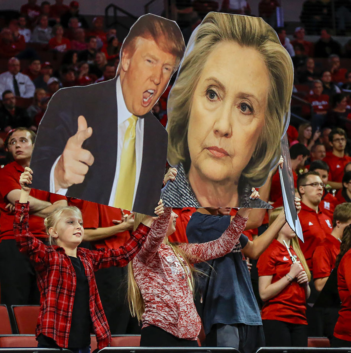2015-1119-Nebraska-fans-Donald-Trump-Hillary-Clinton-big-heads.jpg