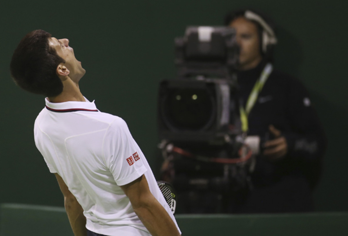 Djokovic reacts after losing a point to Karlovic in Doha. 