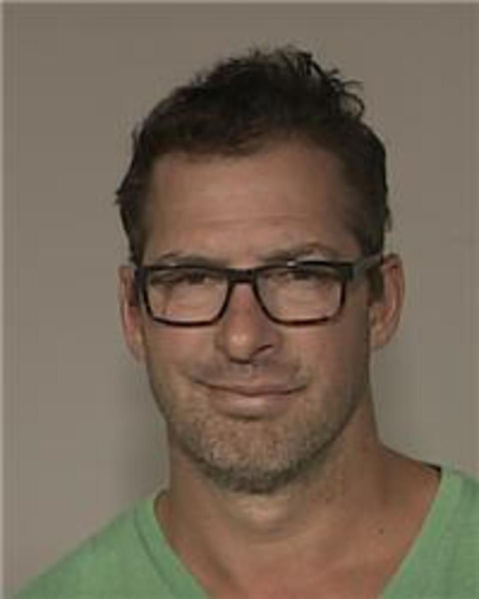 In this Aug. 20, 2015,  booking photo made available by the Anoka County Sheriff's office, Minnesota Wild NHL assistant coach Darryl Sydor is shown. Sydor has been charged with drunken driving after being arrested while taking his 12-year-old son to a hoc