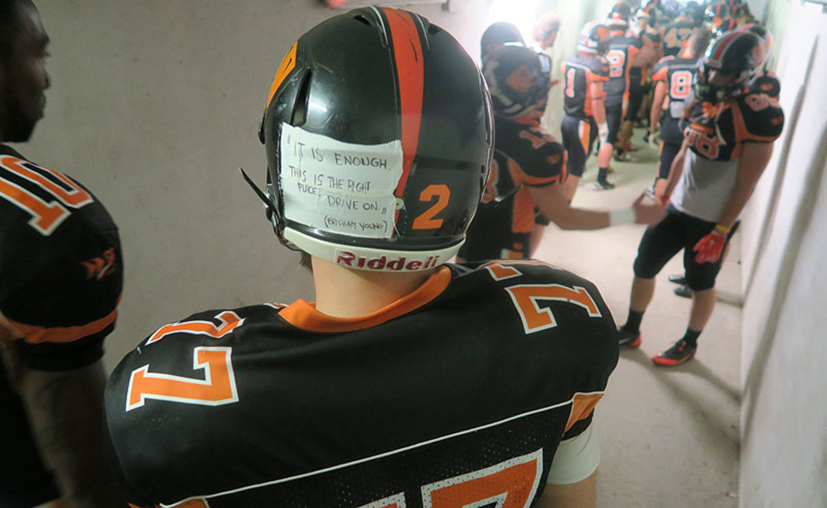 Rhinos center Matteo Piccoli tapes a handwritten note to his helmet before each game. (Jenny Vrentas/The MMQB)