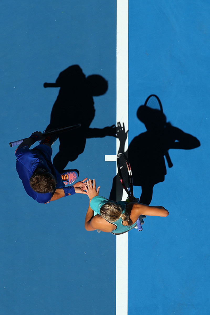 Vasek Pospisil and Eugenie Bouchard of Canada celebrate a point in the mixed doubles match against Fabio Fognini and Flavia Pennetta at Hopman Cup.