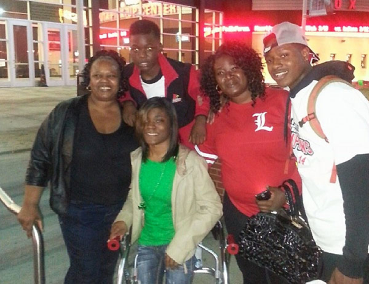 From left to right: Amanda Tucker, BJ Tucker (above), Tre'Dasia Tucker (below), Gina Tucker and Terry Rozier.