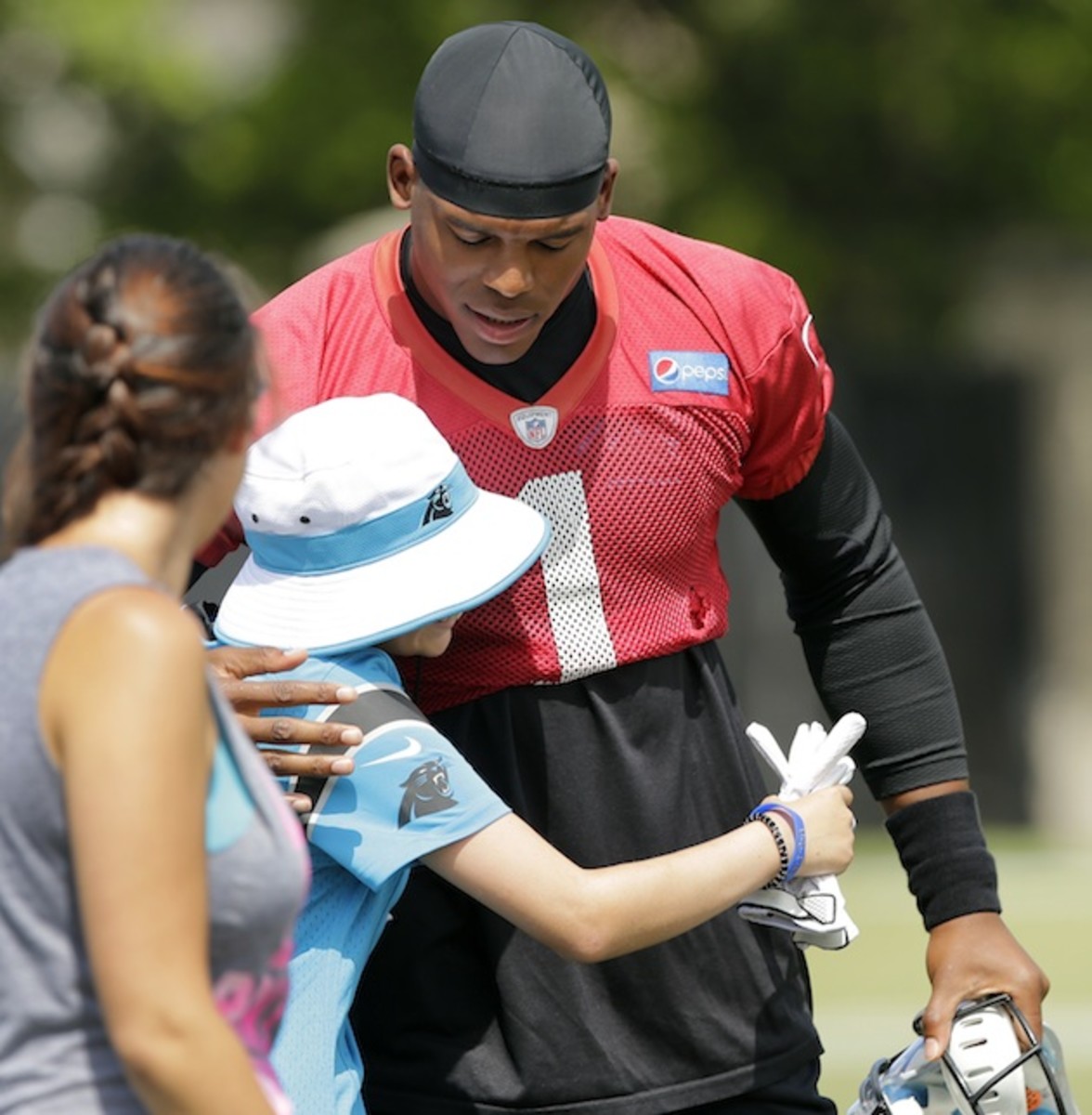 cam-newton-carolina-panthers-angry-mom-fan-letter-hugging-fan.jpg