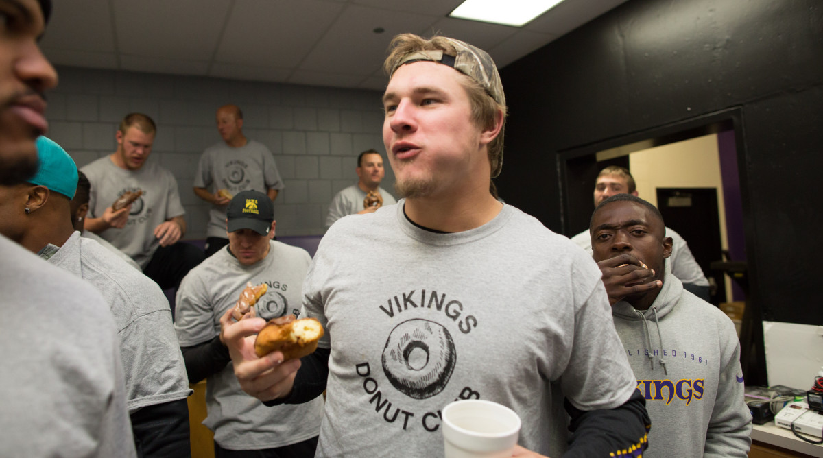 Dedicated Donut Club member Audie Cole devours his pastry.