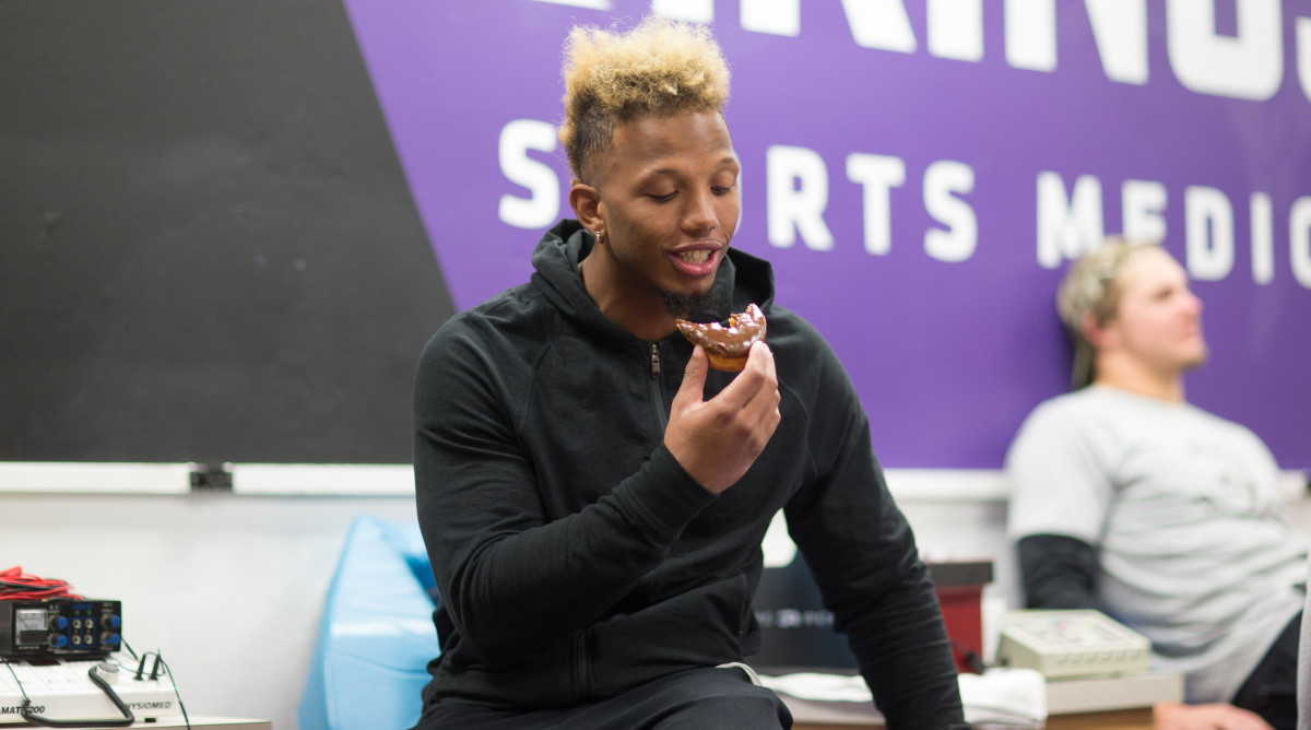 Wide receiver Charles Johnson has no problem finishing his donut.