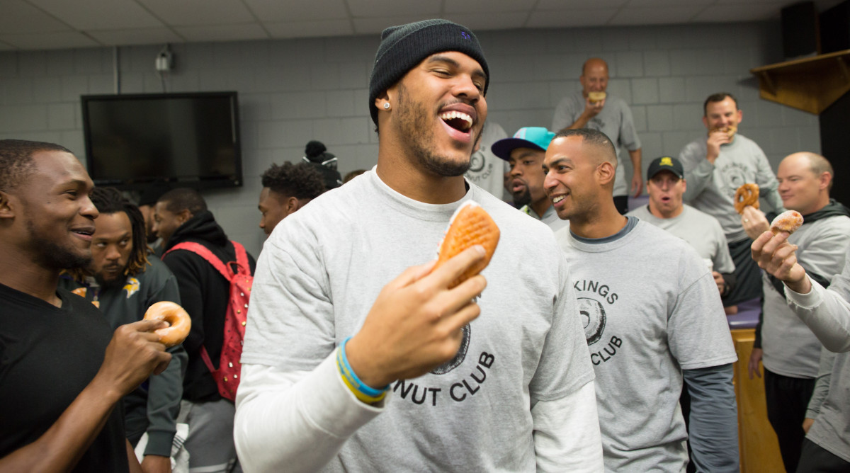 Linebacker Anthony Barr, in proper uniform, celebrates the time to finally eat his donut. 