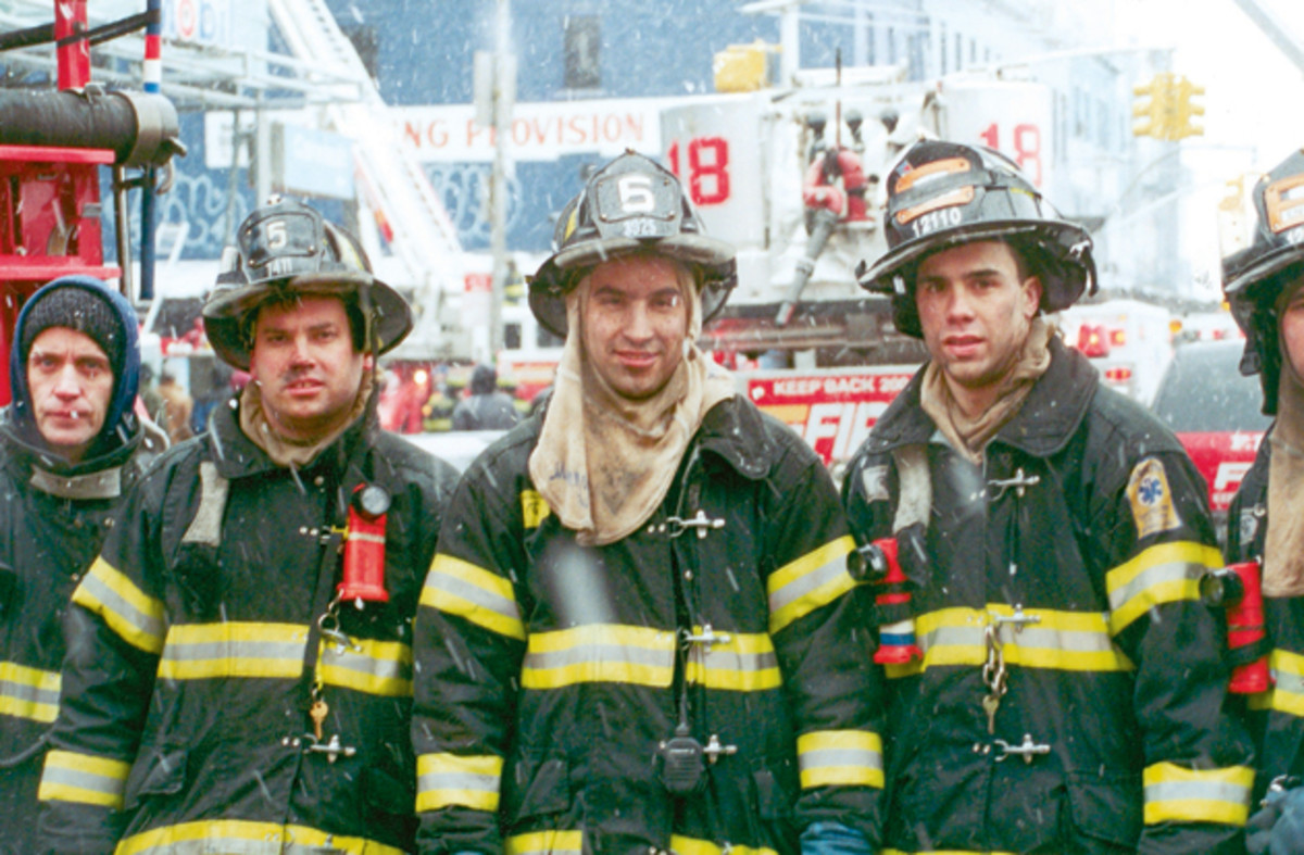 Jimmy barely escaped the collapsing tower, but his Engine 5 friend Manny Del Valle (center) was still missing as of Monday.