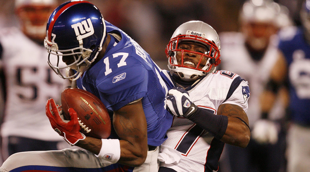 Ellis Hobbs and the Patriots had a hard time stopping Plaxico Burress, who finished with a pair of touchdowns.