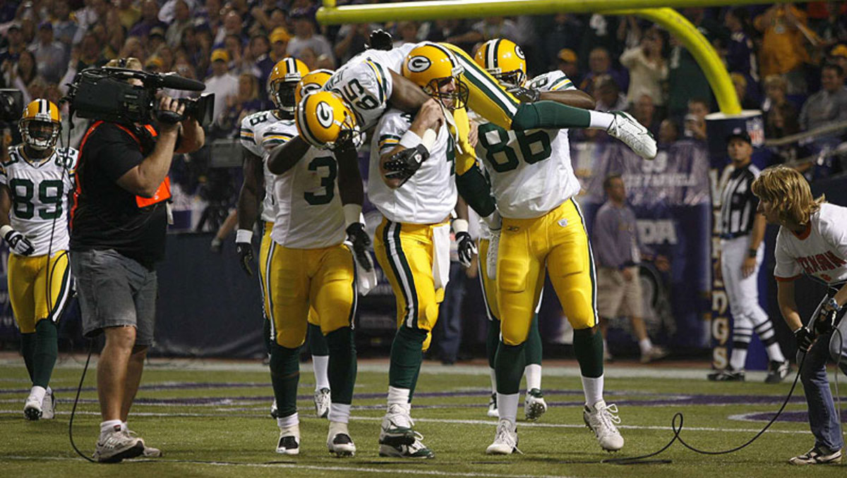 Brett Favre lifted Greg Jennings onto his shoulders after breaking Dan Marino's touchdown record in 2007. (John Biever/Sports Illustrated)
