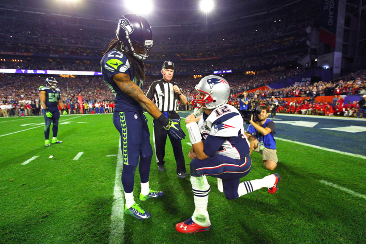 No trash talk this time. Just a handshake between Richard Sherman and Tom Brady. (Al Tielemans/Sports Illustrated/The MMQB)