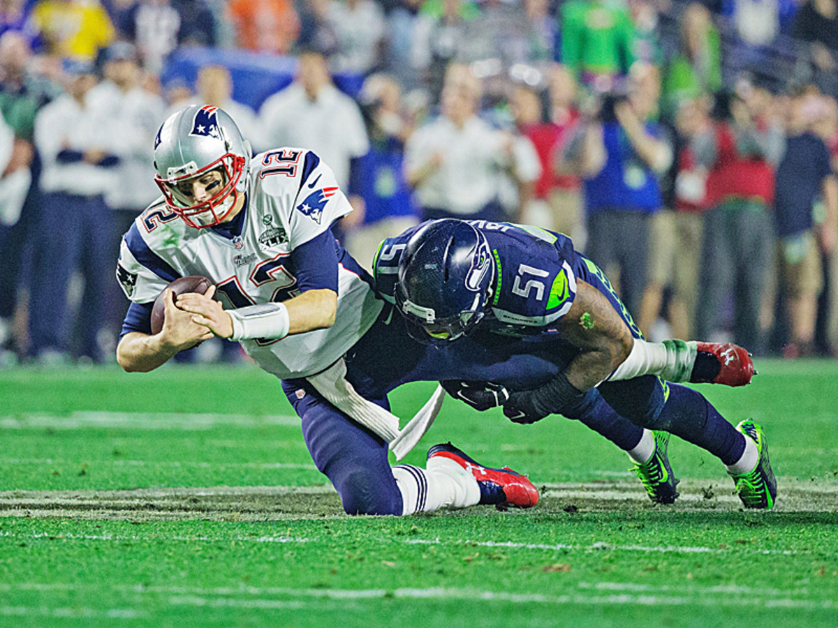 The first of New England's two fourth-quarter scoring drives started with Brady being sacked by Bruce Irvin. (Simon Bruty/SI/The MMQB)
