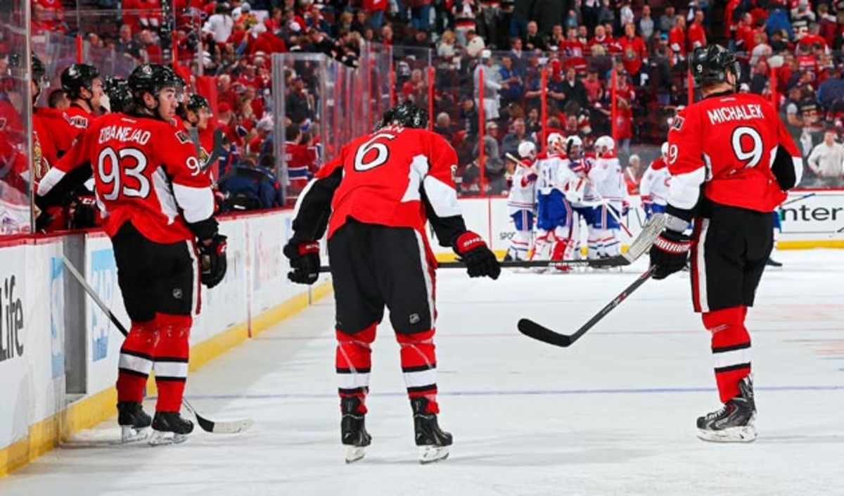 The Senators watch the Canadiens celebrate after Montreal scored in OT of Game 3 in their first-round series.