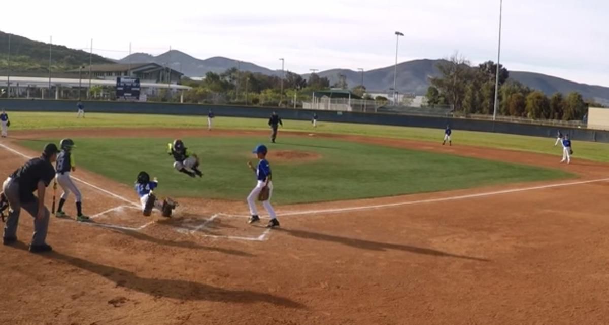 Video U11 baseball player jumps over catcher to score
