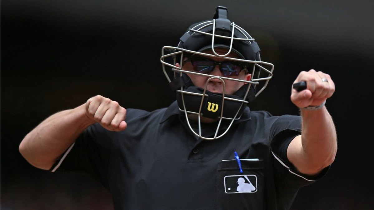San Francisco Giants fans dress as umpires, sit behind home plate