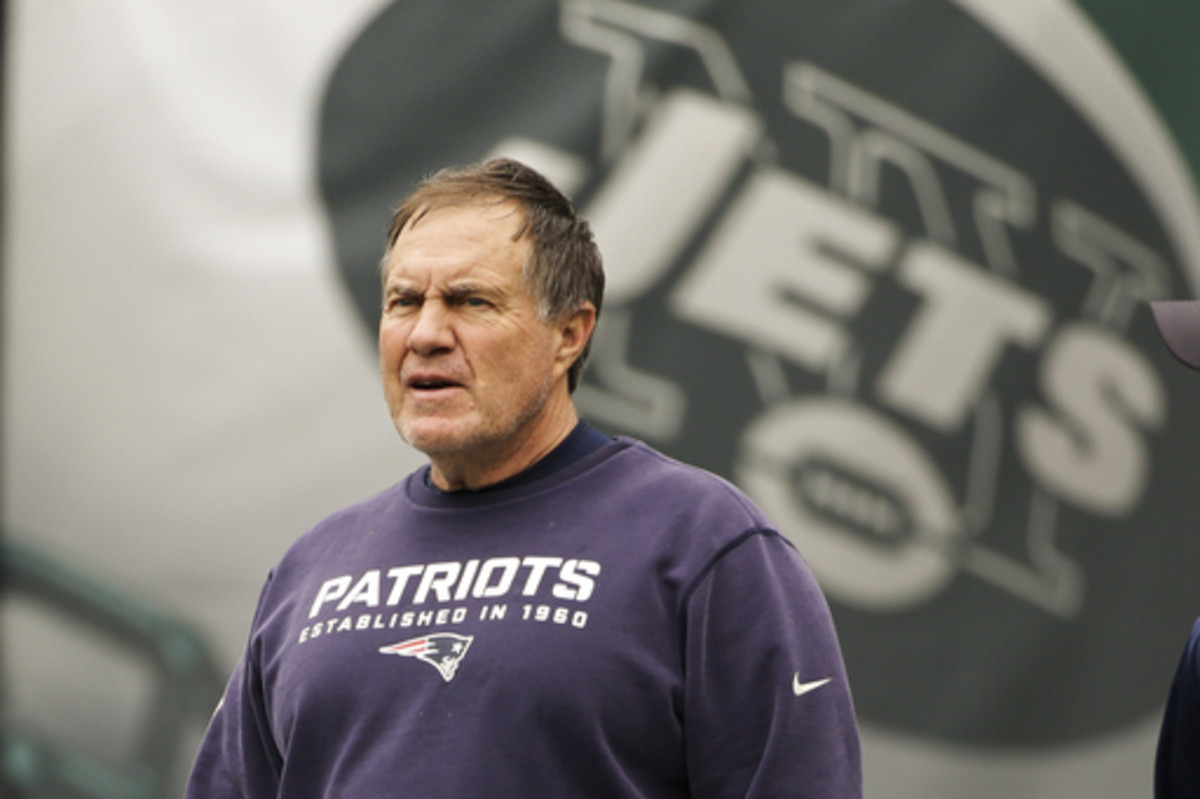 New England Patriots head coach Bill Belichick watches his team warm up before an NFL football game against the New York Jets, Sunday, Dec. 27, 2015, in East Rutherford, N.J.  (AP Photo/Seth Wenig)