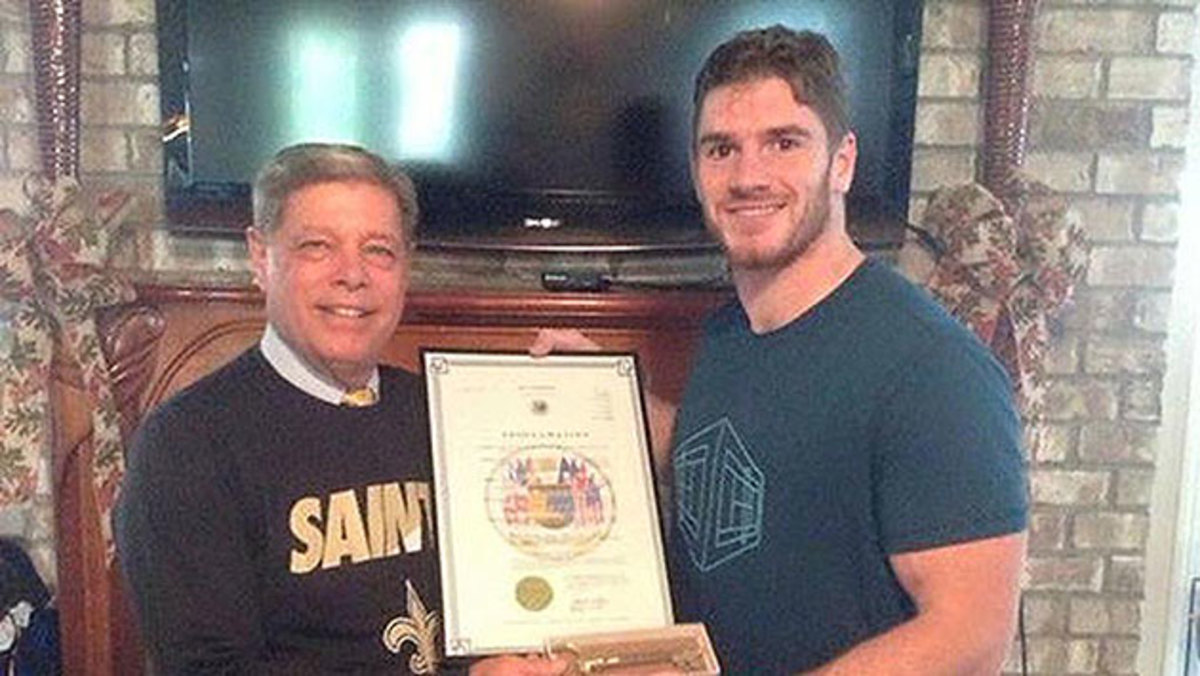 Mandeville mayor Donald J. Villere, left, showed up at Mauti’s house with a key to the city and a proclamation for a day in Mauti’s honor.