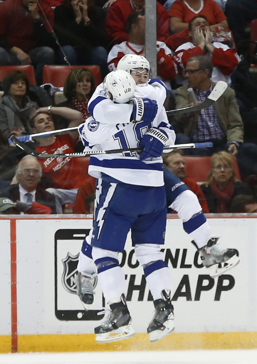 Tampa Bay Lightning center Tyler Johnson, facing, celebrates his goal against the Detroit Red Wings with Ondrej Palat in the second period of Game 6 of a first-round NHL Stanley Cup hockey playoff series, Monday, April 27, 2015, in Detroit. (AP Photo/Paul