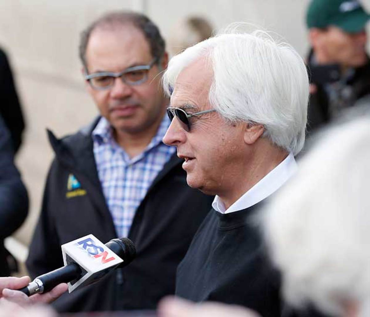 American Pharoah’s owner, Ahmed Zayat (above, left), listens to Bob Baffert, the colt’s trainer.