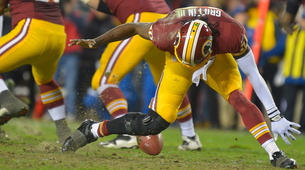 RG3 exacerbated a knee injury in a January 2013 playoff game, changing the course of his career. (John McDonnell/Getty Images)