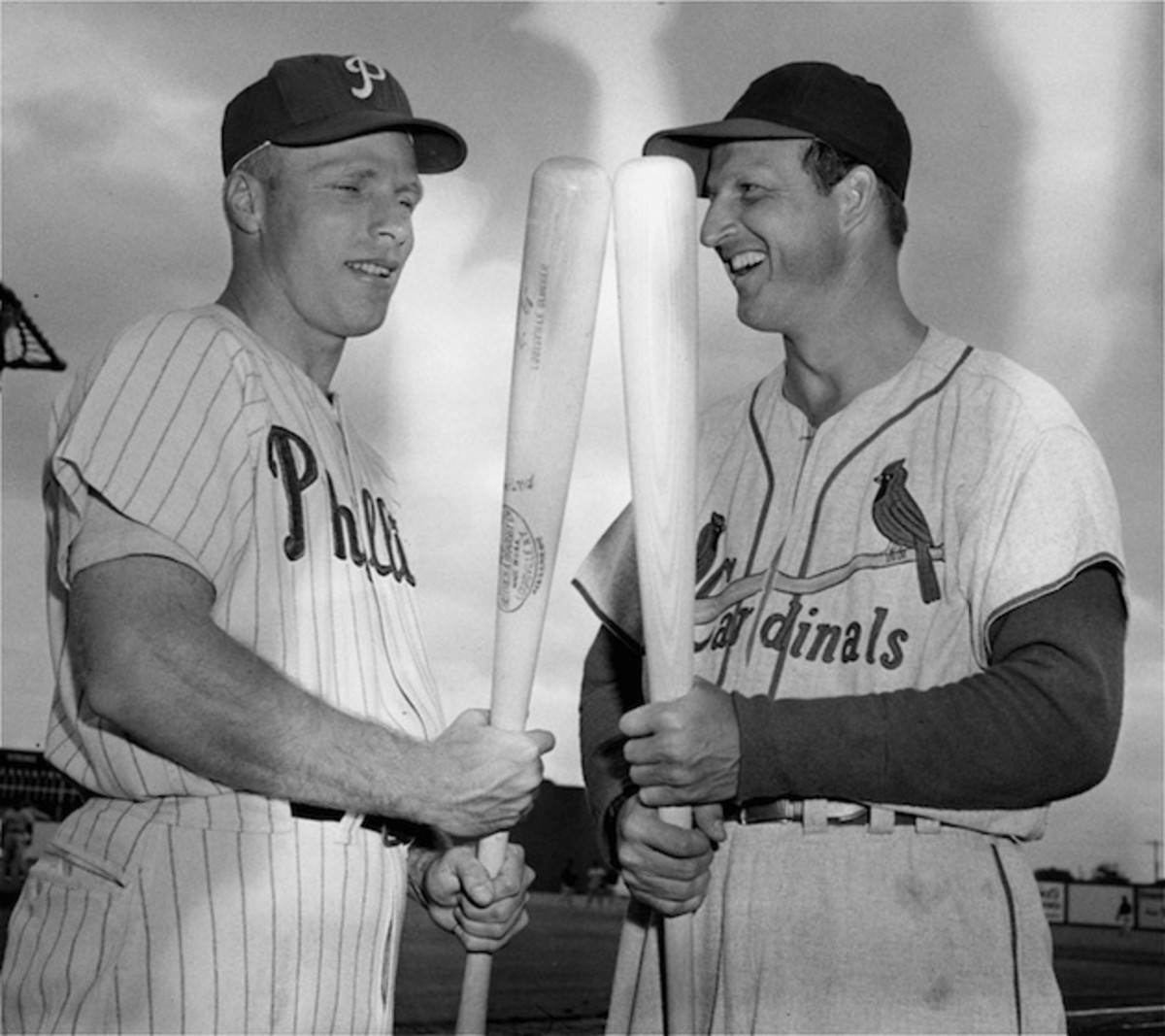 Richie Ashburn, pictured here with Stan Musial in 1955, was known to sleep with his bat.  