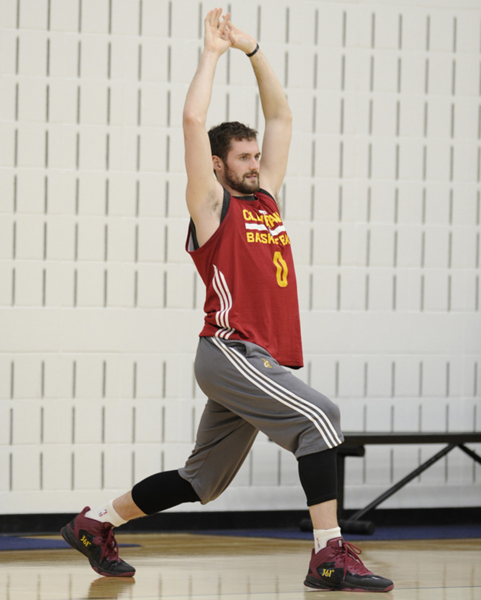Cleveland Cavaliers forward Kevin Love stretches to loosen up his muscles prior to a team practice. 