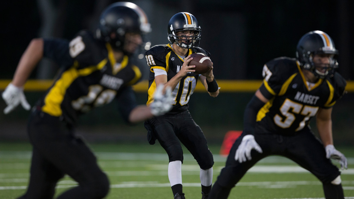 Sherman has abandoned Nauset’s single-wing and relies more on his quarterback’s mobility, though the offense remains basic. (Photo: Bill Johnson for The MMQB)