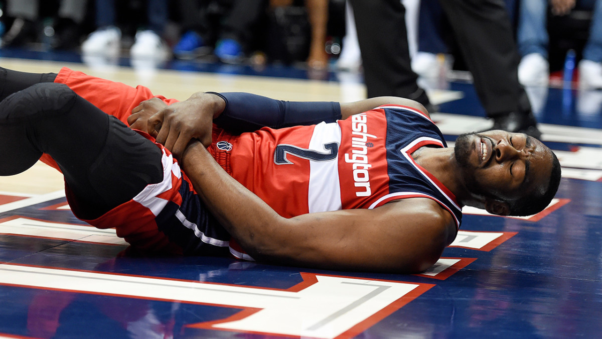 John Wall hopes he can play through fracture Sports Illustrated