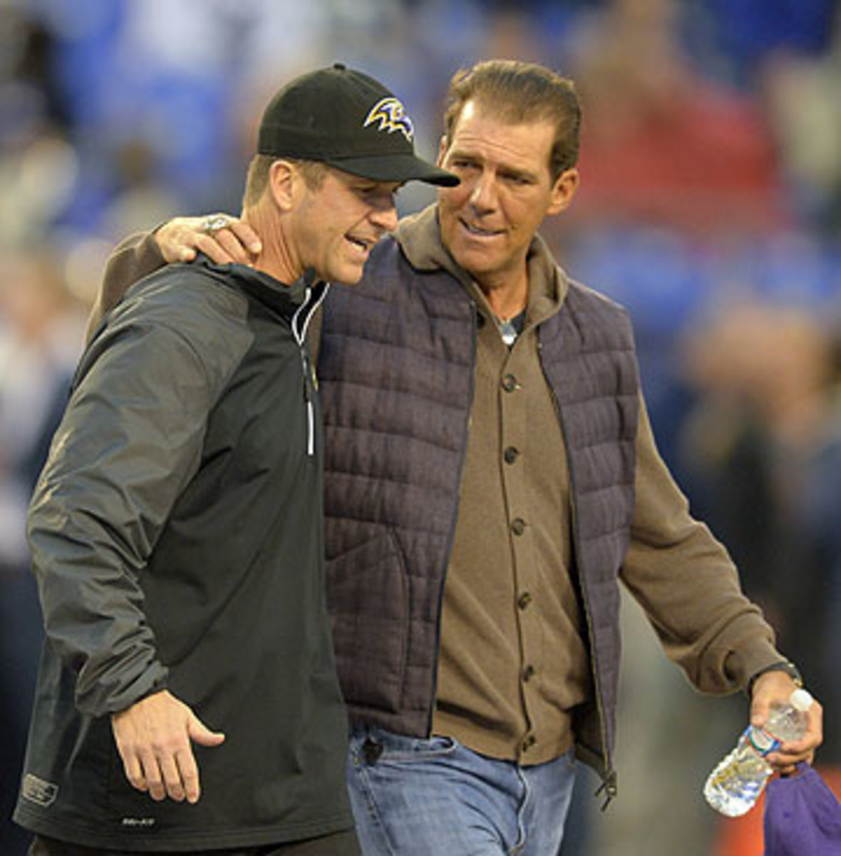 Harbaugh, with Ravens owner Steve Bisciotti (Doug Kasputin/Getty Images)